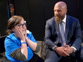 Windsor spina bifida patient Faith Turner, 18, tries to keep her composure while meeting her hero, pro wrestling superstar Triple H, backstage at WWE Monday Night Raw on April 1, 2019.