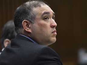 FILE--In this April 10, 2019, file photo, former Michigan state trooper Mark Bessner listens to Assistant Wayne County Prosecutor Matthew Penney deliver his opening argument in Bessner's trial, in Detroit. Charged with second-degree murder, Bessner was convicted of involuntary manslaughter Wednesday, April 17, 2019, in the death of Detroit teenager, Damon Grimes, who crashed an all-terrain vehicle and died when he was shot with a Taser by Bessner in 2017. (Clarence Tabb Jr./Detroit News via AP, File)/Detroit Free Press via AP) ORG XMIT: MIDTN201