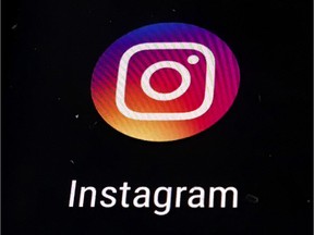 FILE - In this Nov. 29, 2018 file photo, the Instagram app logo is displayed on a mobile screen in Los Angeles.