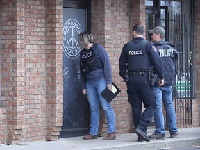 Windsor police officers at Compassion House (405 Tecumseh Rd. West) on Nov. 7, 2018. Police raided the storefront due to suspicions of illegal retail cannabis. The investigation resulted in arrests and charges.