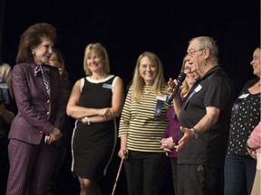 Thomas Cassidy, 74, who lost 52.1 lbs, shares his weight loss story on stage with Florine Mark, president and CEO of the WW Group co., at the Celebration of Success at St. Thomas of Villanova High School, Monday, April 1, 2019.