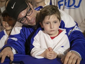 Canadien's Max Domi tries to get a smile out of Émile Paré, 5, after talking with youngsters who have Type 1 diabetes on Tuesday.