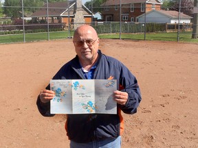 Dan Kolbylka, 64, still has the card he received from nurses in the chronic care unit at the former Public General Hospital after he received a heart transplant on May 29, 1989 at University Hospital in London. He posed for the picture at his favorite place, Kinsmen Field in Chatham, where he organizes Challenger Baseball for adults with disabilities. Ellwood Shreve/Postmedia Network