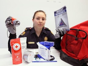 Emergency Planning Officer Emily Bertrum displays some of the items which are reccommended for your 'grab-and-go" bag for your home, automobile and/or work station May 6, 2019.