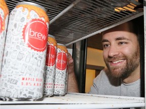 Jordan Goure of Brew microbrewery does an inventory check of Brew's Maple beer May 7, 2019.