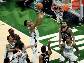 Giannis Antetokounmpo #34 of the Milwaukee Bucks attempts a shot in the fourth quarter against the Toronto Raptors during Game Two of the Eastern Conference Finals of the 2019 NBA Playoffs at the Fiserv Forum on May 17, 2019 in Milwaukee, Wisconsin. NOTE TO USER: User expressly acknowledges and agrees that, by downloading and or using this photograph, User is consenting to the terms and conditions of the Getty Images License Agreement.