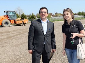 Leamington District Secondary School principal Kyle Berard tours the the school's new athletic field with Kara Badder of NatureFresh, a major supporter of the project.