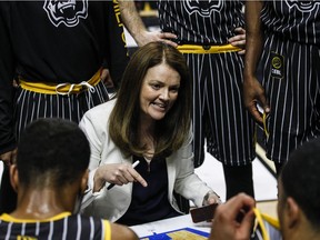 Coach Chantal Vallée huddles with Hamilton Honey Badgers players during the team's inaugural game in the Canadian Elite Basketball League against the Edmonton Stingers on Sunday, May 12, 2019.