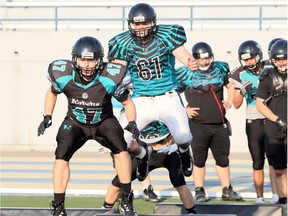 Essex Ravens linebacker Everett Vanlare, at left, picked off a pass for one of the team's five touchdowns in Saturday's 38-16 win over London in the OPFL West Division final.