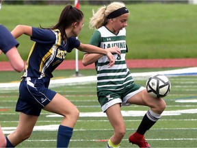 Lajeunesse Royals midfielder Lauren Hodgins, right, tries to control the ball as Pain Court's Natasha Anderson closes in during Thursday's SWOSSAA senior girls' A soccer final at Holy Names high school.