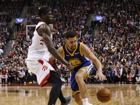 Golden State Warriors' Klay Thompson, rght, is seen in this May 30, 2019 file photo going against Toronto Raptors' Pascal Siakam.
