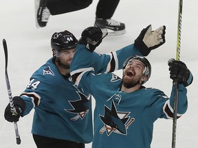 San Jose Sharks right wing Joonas Donskoi, right, celebrates with defenseman Marc-Edouard Vlasic (44) after scoring a goal against the Colorado Avalanche during the second period of Game 7 of an NHL hockey second-round playoff series in San Jose, Calif., May 8, 2019.