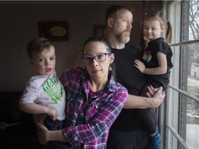 Meg Ball Rigden holds Liam Rigden, 2, who was diagnosed with level 3 autism, while Craig Rigden holds Kieran Rigden Roy, 4, who was diagnosed with level 2 autism, at their home in East Windsor, Thursday, March 21, 2019.