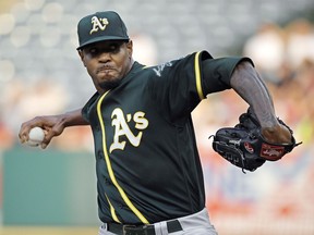 In this Aug. 11, 2018, file photo, Oakland Athletics starting pitcher Edwin Jackson throws during the first inning of a baseball game against the Los Angeles Angels in Anaheim, Calif. Jackson is poised to set a major-league record on Wednesday for the Toronto Blue Jays.