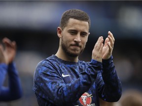 Chelsea's Eden Hazard waves to fans at the end of the English Premier League soccer match between Chelsea and Watford at Stamford Bridge stadium in London, Sunday, May 5, 2019.