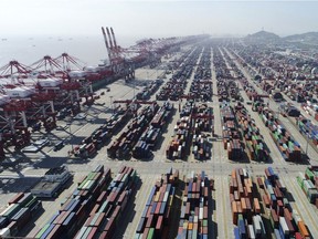 This April 23, 2017, photo shows a container dock of Yangshan Port in Shanghai, east China. U.S. President Donald Trump's latest tariff hikes on Chinese goods took effect May 10, 2019, and Beijing said it would retaliate, escalating tensions in fight over China's technology ambitions and other trade strains.
