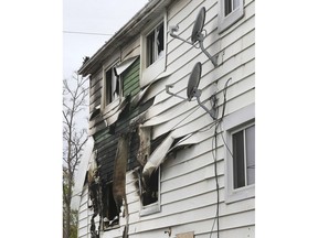 A fire-damaged triplex in the 600 block of Wellington Ave. is shown on Sunday, May 12, 2019.