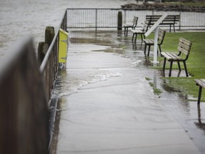 Water from the Detroit River floods a walkway at Shanfield Shores Park on Tuesday May 7, 2019.