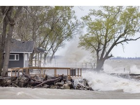 Waves batter the shore of Lake Erie along Cotterie Park Rd., Wednesday, May 8, 2019.
