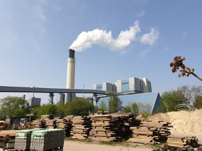 A chimney billows out steam at Berlin's Reuter West thermal power station on April 24, 2019. The energy company, together with a Swedish start-up, is testing the use of salt to store heat, which accounts for more than half the power consumed in Germany.