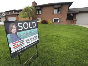 "SOLD" sign is shown at a home in the 1300 block of Harvest Bend Road in South Windsor on Friday, May 24, 2019.