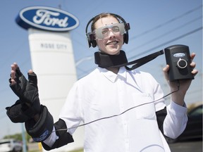 Windsor Star reporter, Taylor Campbell, tries on a drugged driving suit, created by Ford Canada, while at Rose City Ford, Wednesday, May 15,  2019.  The suit allows one to experience what it might be like while being high on drugs and how impaired you'd become.