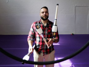 Joe Jelasic, co-owner of Windsor Circus School, juggles inside his business on Pelissier Street in Windsor.