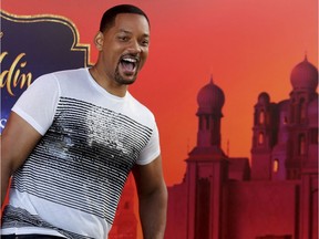 U.S. actor Will Smith reacts during a news conference with director Guy Ritchie and stars Mena Massoud and Naomi Scott, ahead of the regional launching of Disney's live-action "Aladdin," in the Jordanian capital Amman, Monday, May 13, 2019. The film opens in Middle East theaters May 23, 2019.