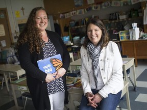 Allison Bolton, left, 3/4 teacher at St. Gabriel Catholic Elementary School and principal Zina Vivier, are pictured, Friday, May 10, 2019, after the school was awarded the EQAC achievement award in improving mathematics skills.