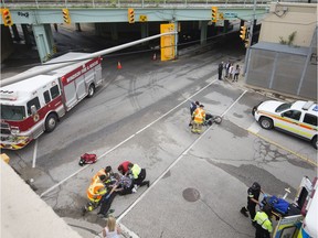 WINDSOR, ONT:. MAY 29, 2019 - Emergency crews treat an older male after he crashed his motorcycle at the intersection of Wyandotte St. East and Drouillard Rd., Wednesday, May 29, 2019.  The male was taken to hospital with unknown injuries.