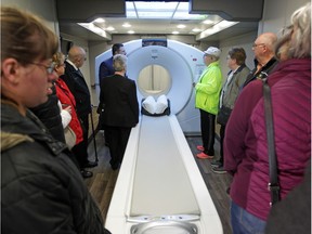 Members of the public take a look at the new PET/CT scanner inside a trailer  at Windsor Regional Hospital's Cancer Program during the centre's first-ever open house Saturday, May 4, 2019.