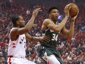 Toronto Raptors Kawhi Leonard SF (2) defends against Milwaukee Bucks Giannis Antetokounmpo PF (34) during first quarter in Toronto, Ont. on Sunday May 19, 2019. Jack Boland/Toronto Sun/Postmedia Network