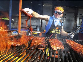 Dallas Cannon from Boss Hogs in London, ON. sauces ribs at the Windsor Rib and Craft Beer Festival on Friday, May 31, 2019 at the Festival Plaza in Windsor.