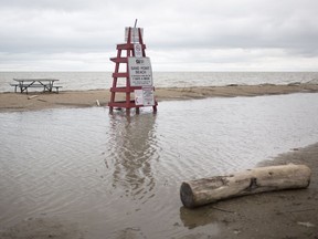 A large pool of water sits in the middle of Sand Point Beach as lake levels in Lake St. Clair reach record highs, Monday, May 13, 2019.