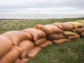 Sandbags are placed outside the restroom facilities at Sandpoint Beach to protect against flooding from Lake St. Clair, Monday, May 13, 2019.