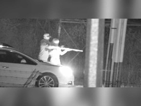 A surveillance camera image of the male and female suspect who practiced shooting a long gun on Lauzon Road in the early hours of May 4, 2019.