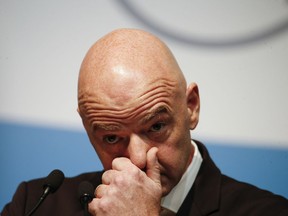 In this Dec. 1, 2018, file photo, FIFA president Gianni Infantino gestures during a press conference at the G20 Leaders' Summit in Buenos Aires, Argentina. Switzerland's attorney general is the subject of a disciplinary case over his handling of a four-year investigation of FIFA that involves 25 criminal proceedings of alleged financial wrongdoing. The federal office overseeing the work of chief prosecutor Michael Lauber says it is examining possible violations of his duties in the FIFA investigation. Swiss media have reported it involves an undeclared meeting Lauber had with FIFA President Gianni Infantino in 2017.