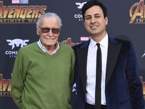 In this April 23, 2018, file photo, Stan Lee, left, and Keya Morgan arrive at the world premiere of "Avengers: Infinity War" in Los Angeles. Morgan, the former business manager of Lee has been arrested on elder abuse charges involving the late comic book icon. Los Angeles police say Morgan was taken into custody in Arizona early Saturday, May 25, 2019, on an outstanding arrest warrant. Morgan was charged earlier this month with felony allegations of theft, embezzlement, forgery or fraud against an elder adult, and false imprisonment of an elder adult.