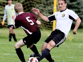 Riverside Rebels' Nikola Kolobaric, right, battles McGregor Panthers' Eli Jobin in the second half of the SWOSSAA senior boys' AA soccer final in Chatham on Tuesday.