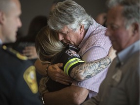 Robert Neroda, whose life was saved in April after he collapsed in his Wheatley home, hugs EMS paramedic, Ashley Bigelow, at the 8th Annual Essex-Windsor Emergency Medical Services (EMS) Survivor Day at the St. Clair Centre for the Arts, Thursday, May 30, 2019.