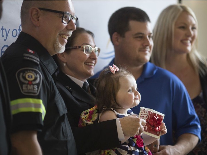  Nine-month-old, Taylor Villemaire, with her father and mother, Scott Villemaire and Renee Villemaire, pose for a photo with EMS Paramedics, Nicole Hanson, and Bill Jacques, at the 8th Annual Essex-Windsor Emergency Medical Services (EMS) Survivor Day at the St. Clair Centre for the Arts, Thursday, May 30, 2019.