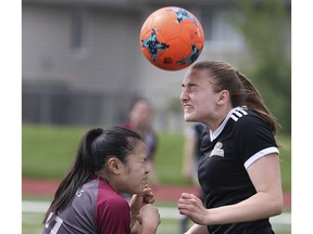 Kayla Noguiera, left, of Wallaceburg, and Megan Bornais of L'Essor battle for the ball during the SWOSSAA girls' AA soccer final on Wednesday, May 29, 2019, at Holy Names High School in Windsor. Restrictions banning extra-curricular activities in Windsor-Essex have been lifted.
