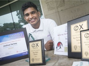 Joshua Varkey, 17, a grade 11 student at Assumption College Catholic High School, is pictured, Tuesday, May 21, 2019, with awards he's won in business competitions this year.