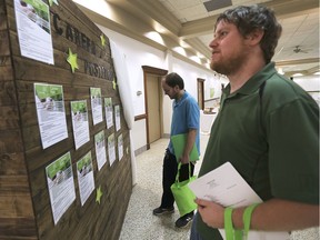 PharmHouse Inc., a soon to open cannabis growing operation in Leamington held a job fair on Thursday, May 16, 2019, at the Lebanese Club. Devin MacWilliams, 25, left, and Connor Deline, 29, check out the job descriptions during the event.
