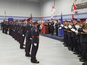 New Windsor police officers are applauded by supervisors at a badge ceremony at the  Major FA Tilston Armoury & Police Training Centre on May 2, 2019.