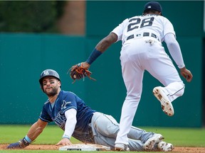 Niko Goodrum #28 of the Detroit Tigers tags out Kevin Kiermaier #39 of the Tampa Bay Rays attempting to steel second base in the sixth inning during a MLB game at Comerica Park on June 6, 2019 in Detroit, Michigan.