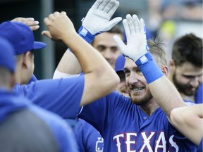 Jeff Mathis #2 of the Texas Rangers celebrates after hitting a solo home run against the Detroit Tigers during the fifth inning at Comerica Park on June 26, 2019 in Detroit, Michigan.