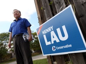 (File) Conservative candidate Henry Lau campaigns in the riding of Windsor West on Sept. 28, 2015.