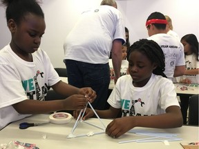 Sisters Lucy and Liz, both 10, work together to build a straw tower at the  WE-STEAM Kid's Summit at the downtown University of Windsor School of Creative Arts on June 7, 2019.