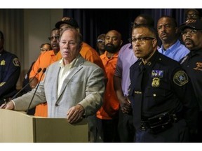 Detroit Mayor Mike Duggan and Detroit police Chief James Craig, right, are shown June 7, 2019, at a news conference announcing the identification of a person of interest in the city's serial killer case.